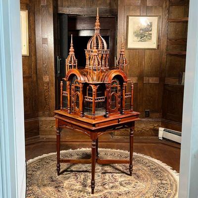 BIRDCAGE ON STAND  |  Intricately carved birdcage top (27.5 x 27 x h. 45 in.) mounted on a stand with a slide out drawer for cleaning...
