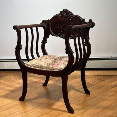 ANTIQUE ARM CHAIR  |  Carved reserve, needlepoint seat - l. 19 x w. 25 x h. 35 in.