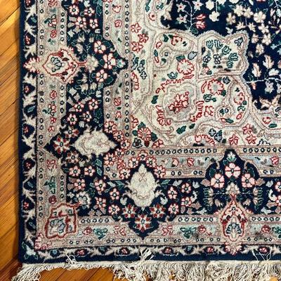 FRENCH STYLE CARPET  |  Central medallion on an indigo field within shaped concentric borders - l. 8.5 x w. 5.5 ft. (approx)

