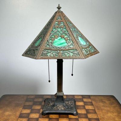 SLAG GLASS DESK LAMP  |  Having six panels with pressed tin overlay on an iron and brass base - l. 16 x w. 14 x h. 21 in.
