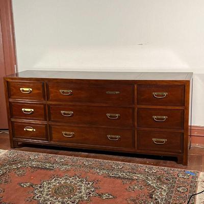 BAKER CHINESE STYLE DRESSER  |  Long chest of drawers of nicely figured wood, having three drawers centered by two banks of three smaller...
