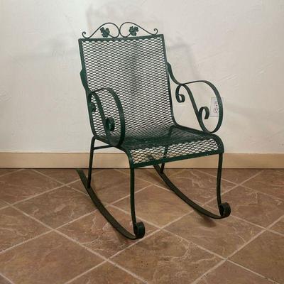 OUTDOOR ROCKING CHAIR  |  Woodard-style, green painted metal with scrolled arms and leaf crest - l. 31 x w. 19 x h. 34-1/4 in.