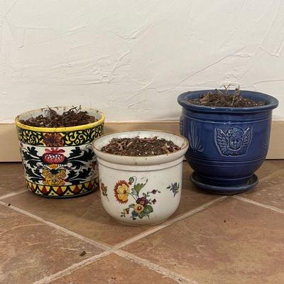 (3pc) CERAMIC PLANTERS  |  Including a blue planter with angels (h. 7 1/2 x dia. 8 in.), a planter with flower and a gilt rim, and a...