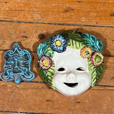 (2pc) CERAMIC WALL MASKS  |  A figural mask and a small blue tribal mask stamped inside "Ceramiche Much..." - l. 6.5 x h. 6.5...
