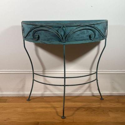 DEMILUNE PLANT STAND  |  Painted metal (faux patinated copper) demilune plant stand with scrolled leafy accents - l. 30-1/4 x w. 13 x h....