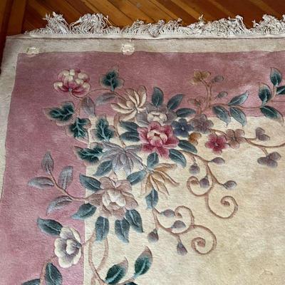 CHINESE WOOL RUG  |  Nichols-style rug, having a beige ground with scrolling floral sprays and a light pink border - l. 11.5 x w. 8.3 ft....