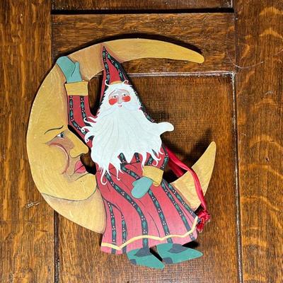 HOUSE OF HATTEN SANTA | Wall hanging decoration of Santa sitting on the moon, signed and dated on verso, "House of Hatten" 1998...