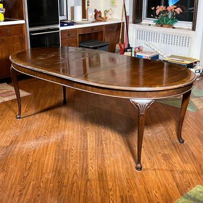 DREXEL DINING TABLE  |  Century Classic Drexel extension dining table of oval shape with an inlaid wood top and shell carved legs, with...