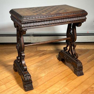 FANCY GAMES TABLE  |  Ornately carved wooden games table with chessboard top - l. 28 x w. 18.5 x h. 31 in.