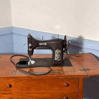 COUNTRY SEWING TABLE  |  False drawer front door, hinged lid to reveal workspace with a Wakefield "Domestic" Sewing Machine...