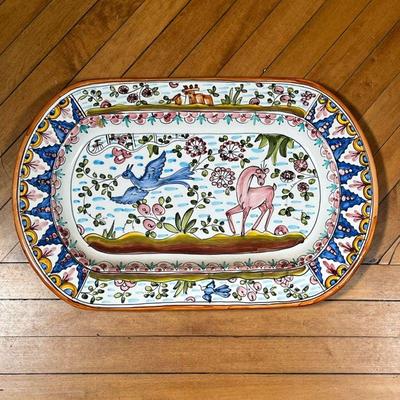PORTUGUESE FAIENCE PLATTER  |  Faience pottery platter decorated with a bird and deer in a landscape, stamped on verso - l. 20.5 x h....