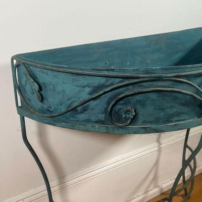 DEMILUNE PLANT STAND  |  Painted metal (faux patinated copper) demilune plant stand with scrolled leafy accents - l. 30-1/4 x w. 13 x h....