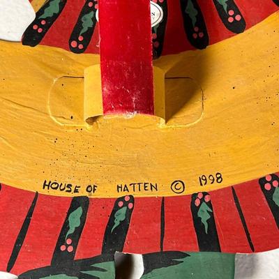 HOUSE OF HATTEN SANTA | Wall hanging decoration of Santa sitting on the moon, signed and dated on verso, "House of Hatten" 1998...