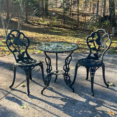 (3pc) OUTDOOR PATIO SET  |  Bistro / cafe set with rose pattern, comprising a round glass top table and a pair of chairs - table h. 27 x...
