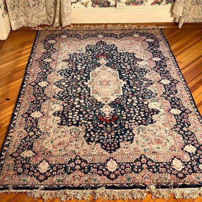FRENCH STYLE CARPET  |  Central medallion on an indigo field within shaped concentric borders - l. 8.5 x w. 5.5 ft. (approx)
