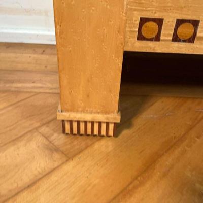 CONTEMPORARY BURL BENCH  |  Scrolled sides, the bottoms inlaid with contrasting woods, having a cushioned seat with red abstract...