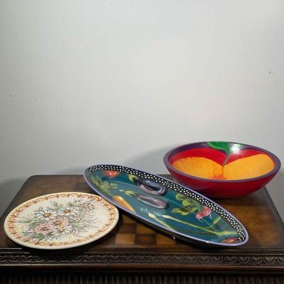 (3pc) SERVING DISHES  |  Including a hand painted wood bowl signed Esther Cassie on the bottom and dated 1992 (dia. 11.5 in.), a floral...