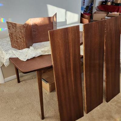 Dining table w/3 leafs and pads for all. Has matching China cabinet and Buffet. Table measures: 29