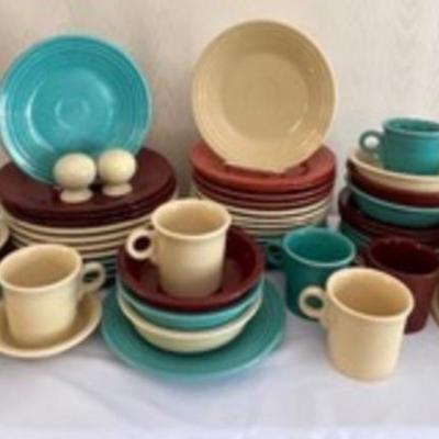 Fiesta Dinnerware in five different colors. Set in good condition with light wear. Varying degrees of wear.
