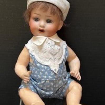 Adorable Vintage Heubach Koppelsdorf Doll. Features beautiful blue eyes and an open month. Measures 12
