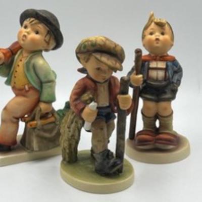 Three Hummel Figurines; Hummel Figurine Merry Wanderer, Hummel Figurine On Secret Path & Hummel Figurine Little Hiker. These figurines...