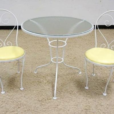 1223	3 PIECE DIMINUTIVE PORCH OR PATIO BREAKFAST SET, IRON BASE TABLE WITH GLASS TOP AND 2 SIDE CHAIRS. TABLE APPROXIMATELY 31 IN X 30 IN H
