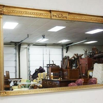 1219	MIRROR IN GILT FINISHED FRAME WITH REEDED COLUMNS, APPROXIMATELY 43 IN X 28 IN H
