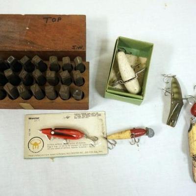 1144	LOT OF FISHING LURES AND LOT OF ALPHA STEEL STAMPS IN WOOD BOX
