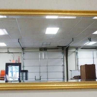 1244	BEVELLED GLASS MIRROR IN GILT FINISHED FRAME, APPROXIMATELY 31 IN X 47 IN
