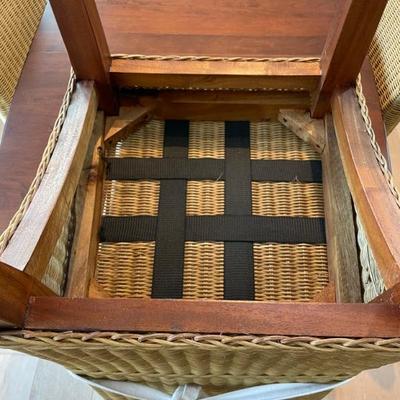 This Keystone Collection dining set features cherry wood and 2 self-storing leaves. The wicker chairs provide comfort and that coastal...