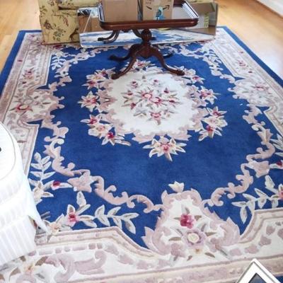 Carved Chinese rug, loveseat, coffee table