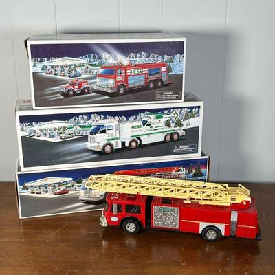 (4pc) HESS TRUCKS  |  
Including a Hess Emergency Truck with Rescue Vehicle, Toy Truck and Helicopter, and a Fire Truck, all in original...