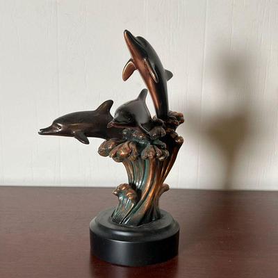 DOLPHIN SCULPTURE  |
Bronze-tone metal, showing three dolphins riding waves - h. 10 1/2 in.