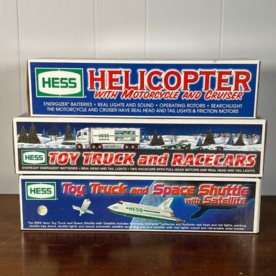 (3pc) HESS TRUCKS  |  
Hess gasoline and other trucks, including a Helicopter with Motorcycle and Cruiser, Toy Truck and Racecars, and...