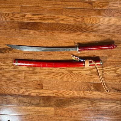SWORD & SHEATH  |
With a red painted wood handle and sheath - l. 33 in.