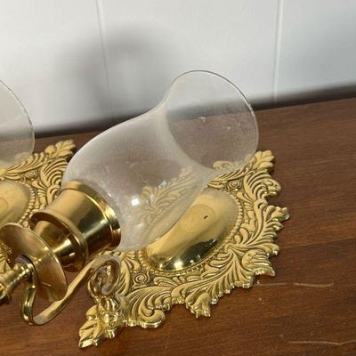PAIR BRASS WALL SCONCES  |  
Pressed brass with glass hurricane shades, made in India - w. 6 1/2 x h. 19 in.