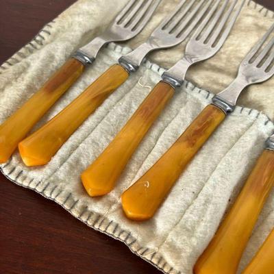 GROUP OF BAKELITE FLATWARE  |  
Knives and forks with Bakelite handles