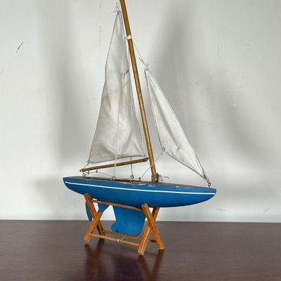 SMALL MODEL SHIP  |  
On a wood stand