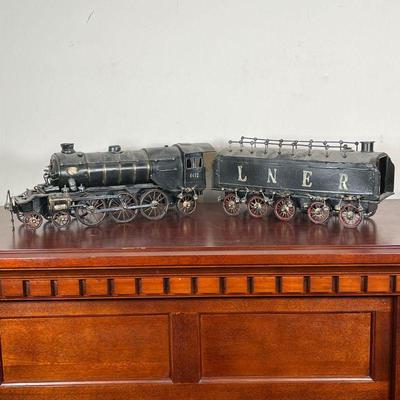 LNER MODEL TRAIN  |  
Including a model locomotive No. 4472 with a LNER Car - l. 30 in. (overall)