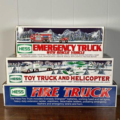 (4pc) HESS TRUCKS  |  
Including a Hess Emergency Truck with Rescue Vehicle, Toy Truck and Helicopter, and a Fire Truck, all in original...