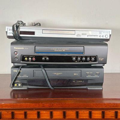 (3pc) DVD PLAYER & VHS PLAYERS  |  
Panasonic DVD Player, Panasonic VHS Player, and Toshiba VHS Player
