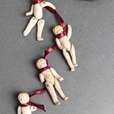 Four Antique Miniature Jointed Bisque Dolls on a Ribbon - Frozen Charlottes / Moving Limbs
