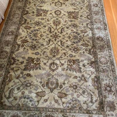 Hand-knotted oriental rug, 68 in by 104 in.