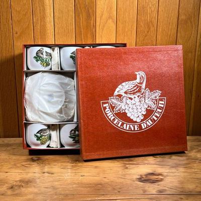 (10pc) BOXED PORCELAINE D'AUTEUIL  |
New in original box, six demitasse cups and six saucers (dia. 5.25 in.) in Service Chasse...