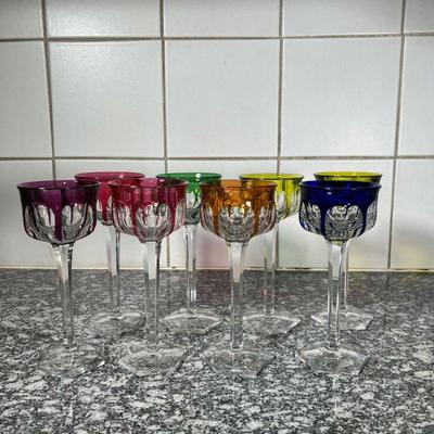 (8pc) COLORED GLASS STEMWARE  |
Tall colored glass stemware, each having a unique colored dripping design - h. 7 1/2 x dia. 3 in.
