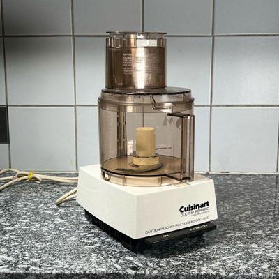 SHIRLEY SONTHEIMER'S MONOGRAMMED CUISINART DLC-7 PRO  |
A Cuisinart food processor with several attachments and many blades and...