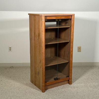 SHELVED WOODEN GLASS DOOR CABINET  |
Two push to open glass door 4 shelved display cabinet and opening top - l. 21.5 x w. 17 x h. 42.75 in.