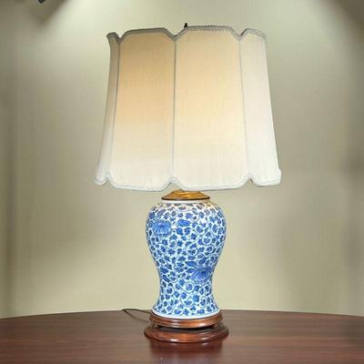 BLUE & WHITE BALUSTER LAMP  |
Porcelain table lamp with scroll and vine decoration, on a wooden base - h. 24 x dia. 16 in. (over shade)