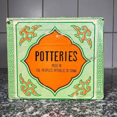 CHINESE TEAPOT  |
Brown clay Chinese teapot with bamboo-form handle with four matching lidded cups - l. 8 in.
