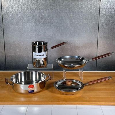 (4pc) CUISINART COOKWARE  |
Stainless steel Cuisinart cookware made in France, all with wood handles, including two frying pans (largest...